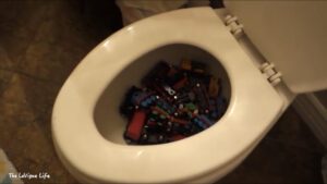 Toy trains inside a toilet bowl