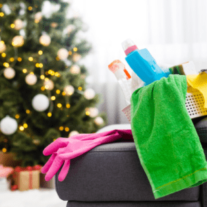 Cleaning supplies in front of a Christmas tree