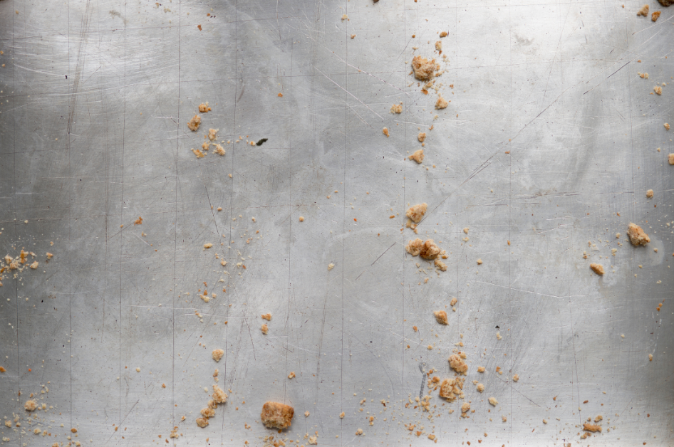crumbs on a concrete floor